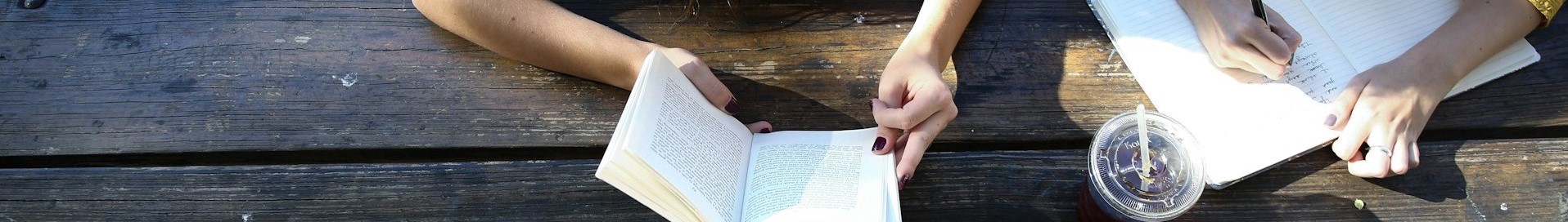 person reading and another person writing